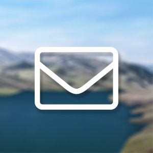 Blurred photo of reservoir with envelope icon floating in the foreground